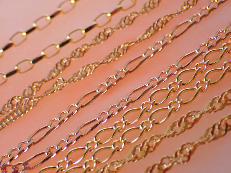Various Style Chains on Pink Background 