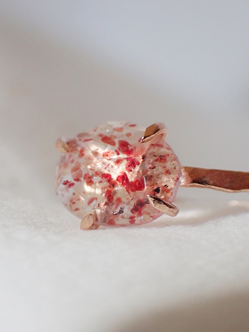 ZOOMED IN STRAWBERRY QUARTZ RING, FOUR PRONGS, ROSE GOLD ON WHITE BACKGROUND